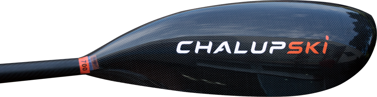 Close-up of a black carbon-fiber ski paddle head with the brand name ChalupSKI in white and orange lettering