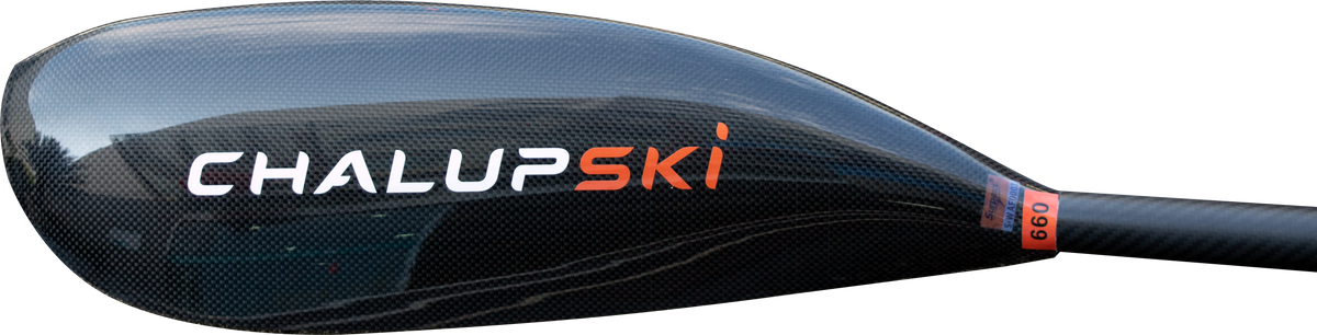 Close-up of a black carbon-fiber ski paddle blade with the brand name 'ChalupSKI' in white and orange